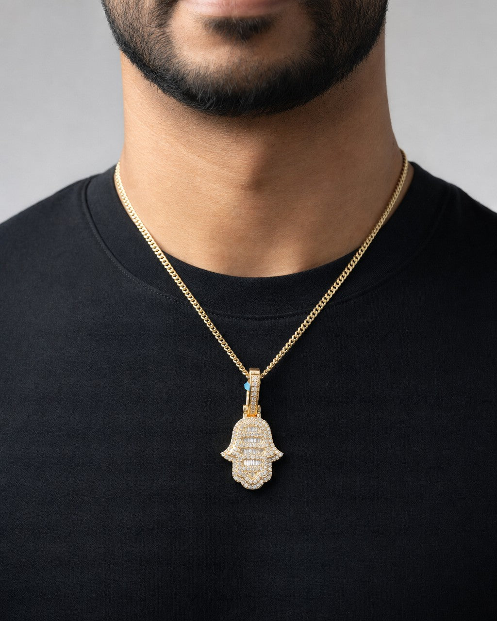 Male model wearing 14K Small Hamsa Diamond Baguette Pendant