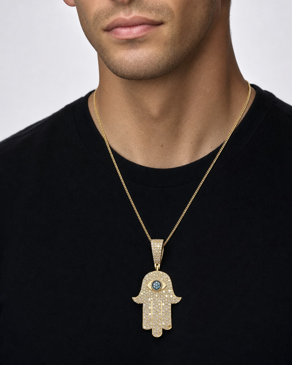 Male model wearing 14K Hamsa Green Eye Diamond Pendant