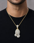 Male model wearing 14K Praying Hands Diamond Pendant