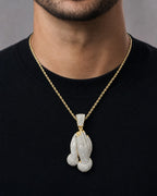 Male model wearing 14K Praying Hands Diamond Pendant