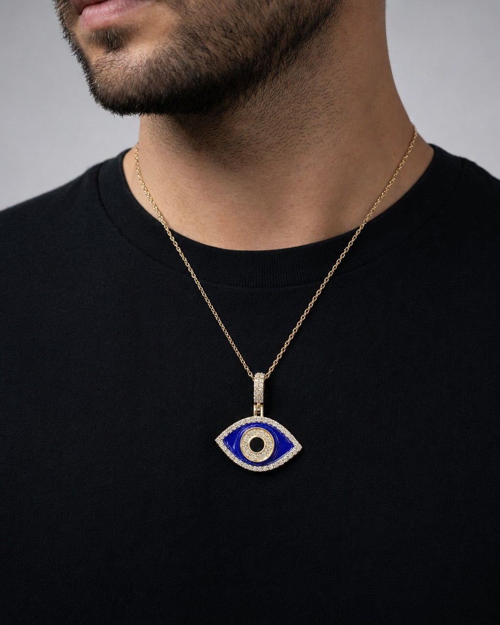 Male model wearing 14K Evil Eye Diamond Pendant