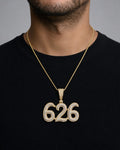 Male model wearing 14K 626 Area Code Diamond Pendant
