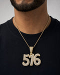 Male model wearing 14K 516 Area Code Diamond Pendant