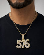 Male model wearing 14K 516 Area Code Diamond Pendant