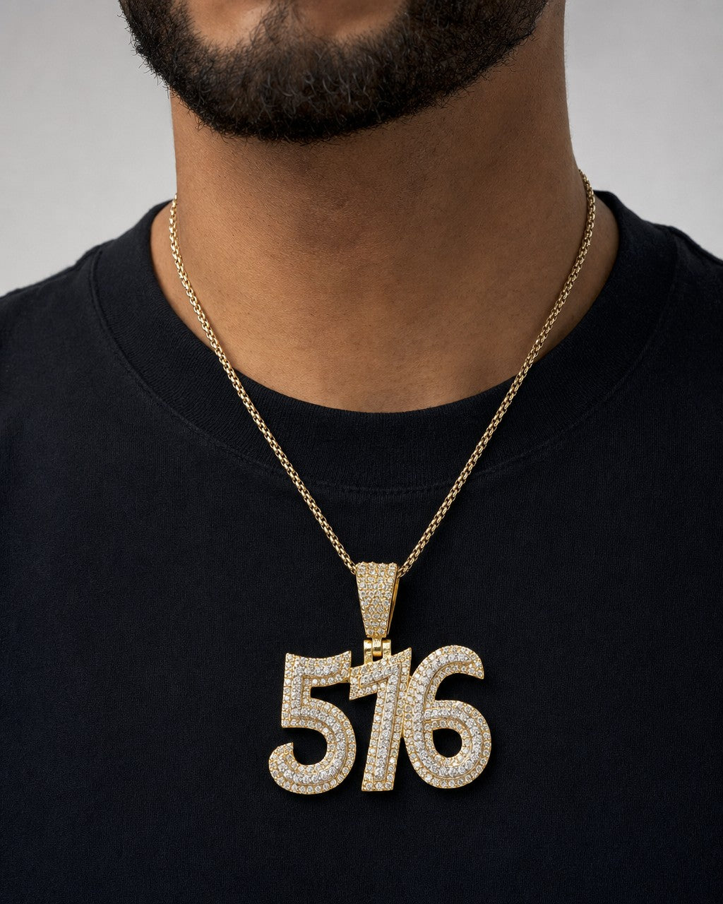 Male model wearing 14K 516 Area Code Diamond Pendant