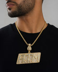 Male model wearing 14K ATM Money Diamond Pendant