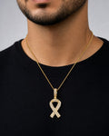 Male model wearing 14K Breast Cancer Awareness Ribbon Diamond Pendant