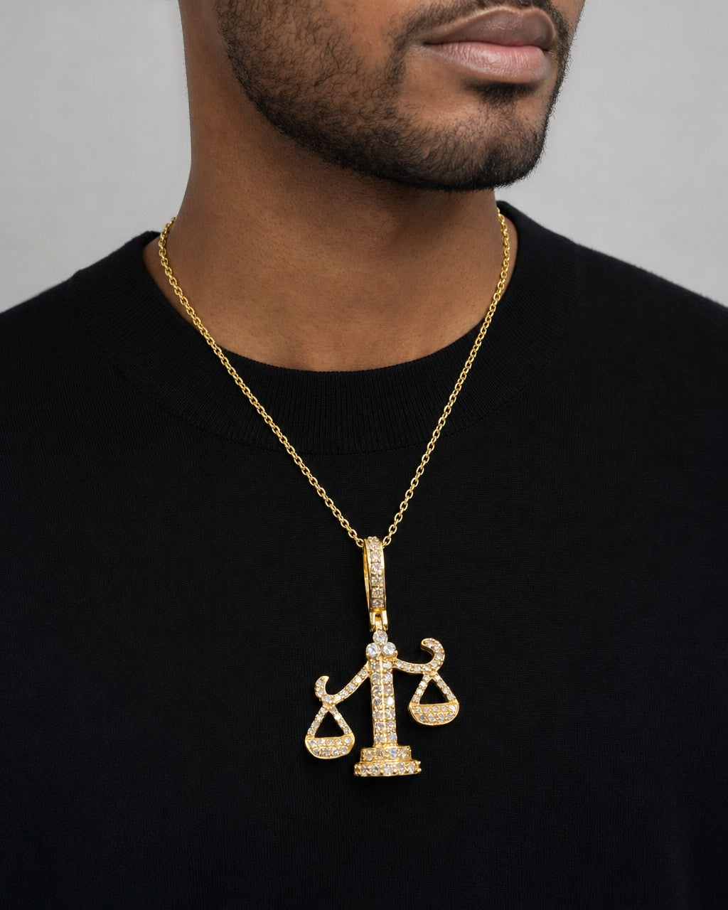 Male model wearing 14K Libra Scale of Justice Diamond Pendant