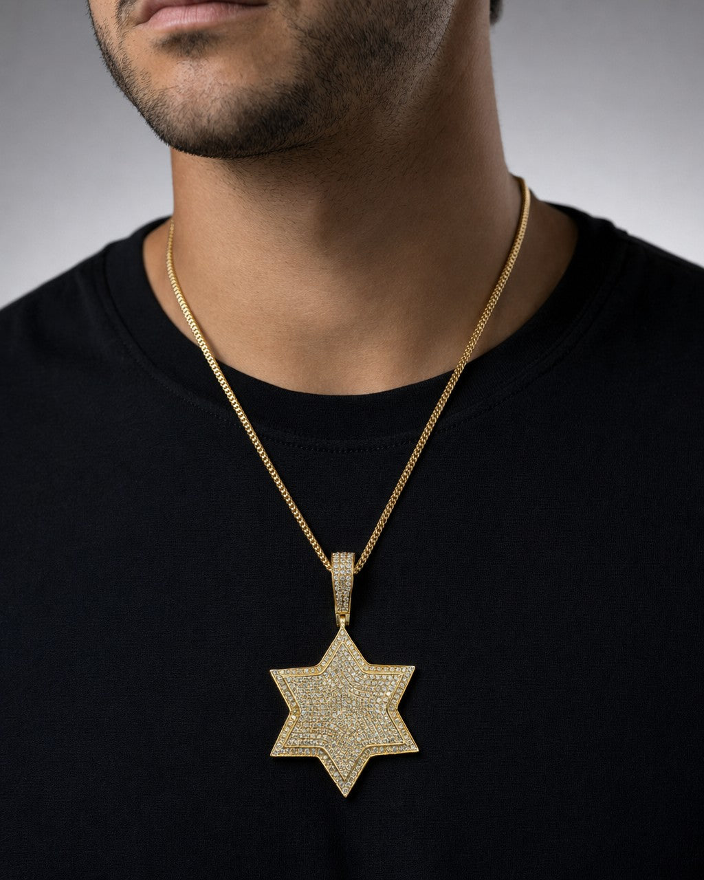 Male model wearing 14k Star Pendant