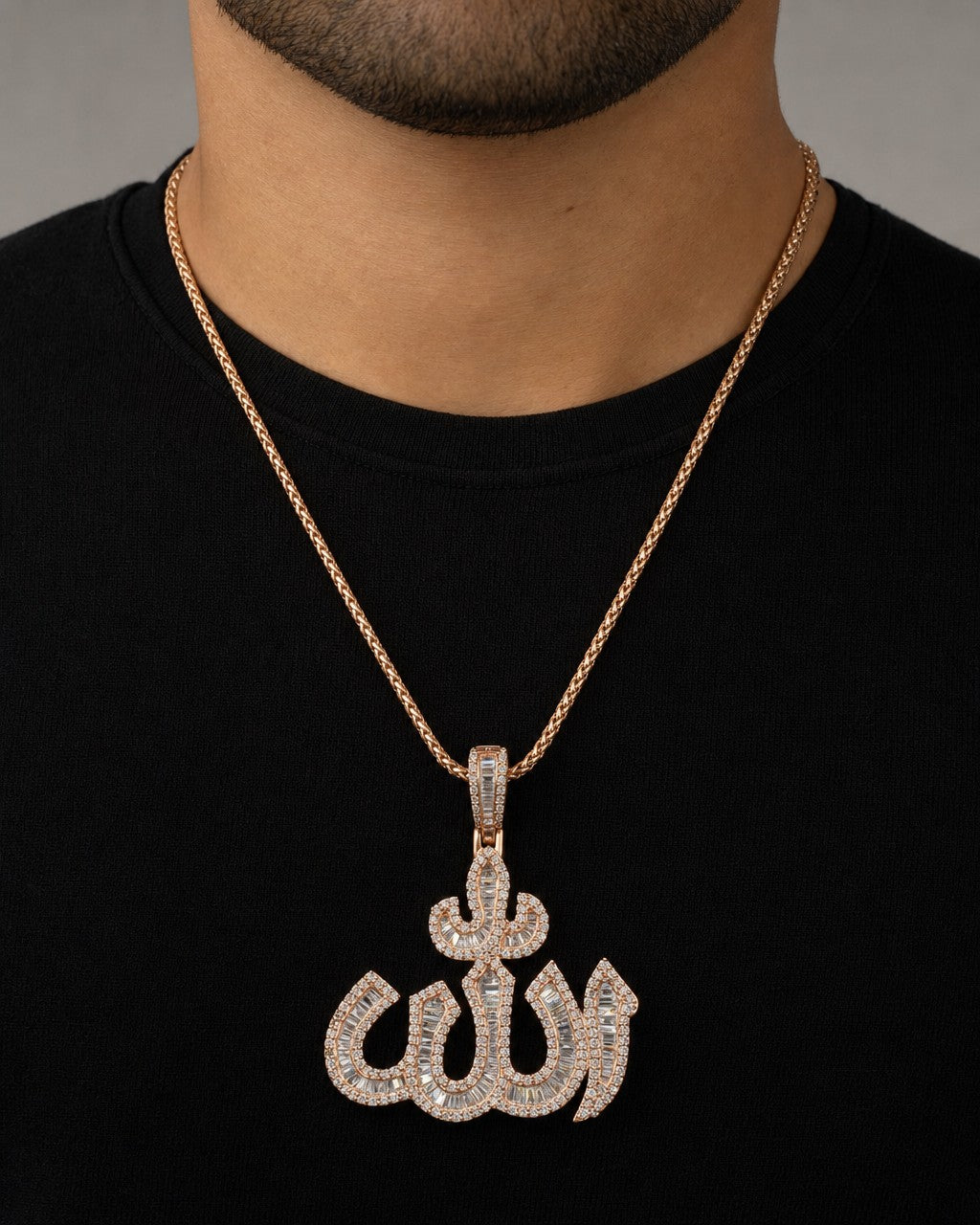 Male model wearing 10K Rose Gold Allah Baguette Pendant
