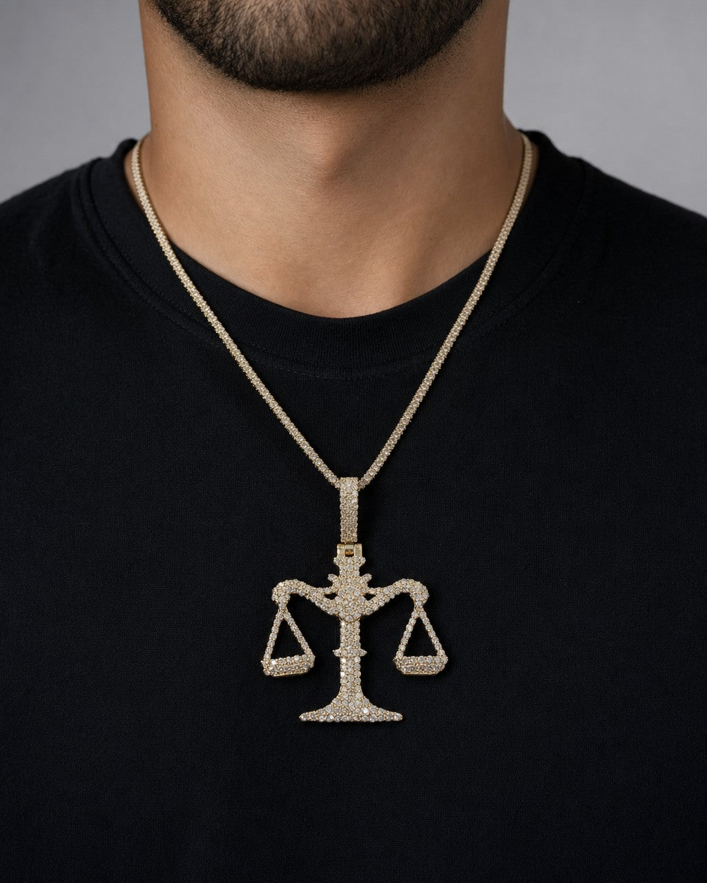 Male model wearing 10K Libra Scale of Justice Diamond Pendant