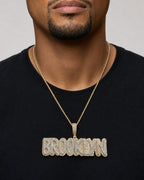Male model wearing Brooklyn Name Pendant