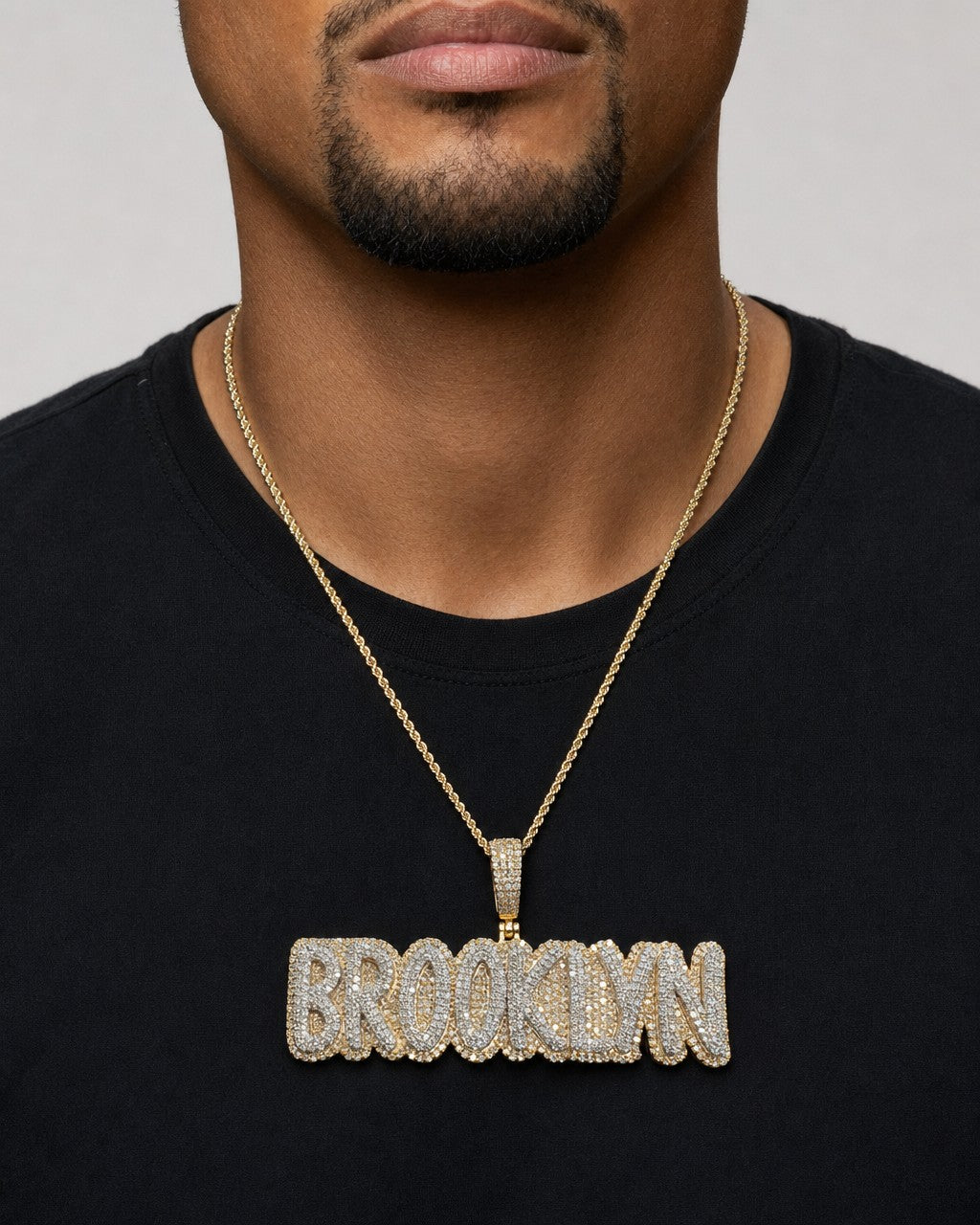 Male model wearing Brooklyn Name Pendant