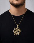 Male model wearing 10k Gold "No Days Off" Pendant