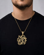 Male model wearing 10k Gold "No Days Off" Pendant