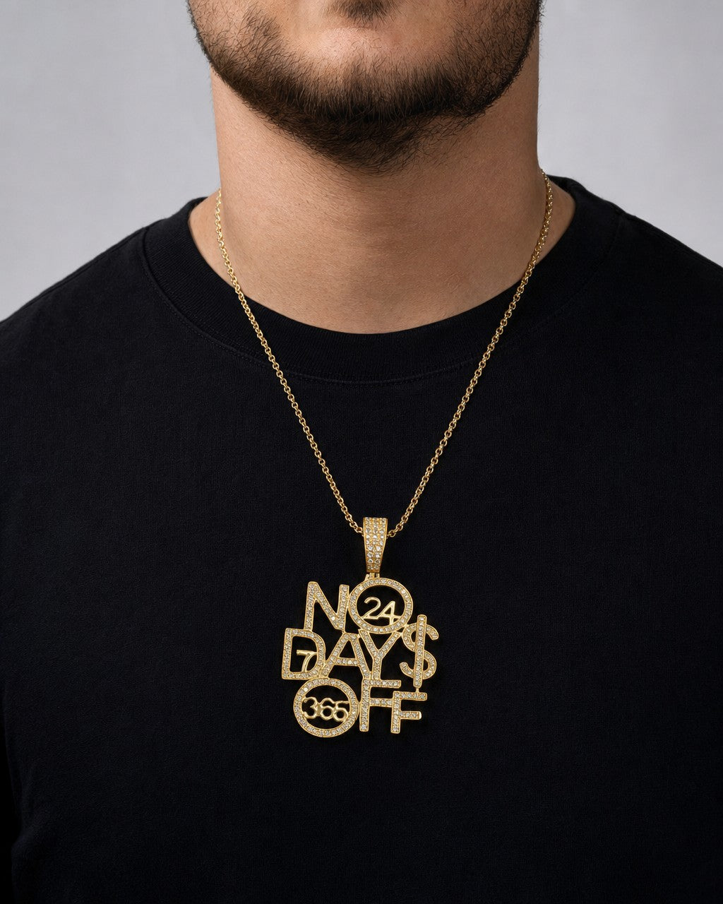 Male model wearing 10k Gold "No Days Off" Pendant