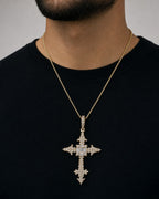 Male model wearing 10K Baguette Trefoil Cross Pendant
