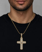 Male model wearing 10K Knot Diamond Cross Pendant