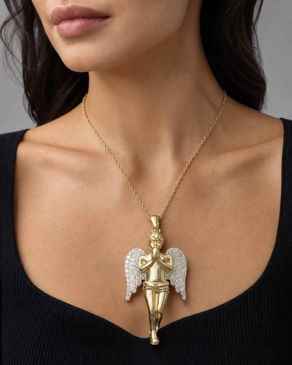 Female model wearing 10K Angel Diamond Pendant