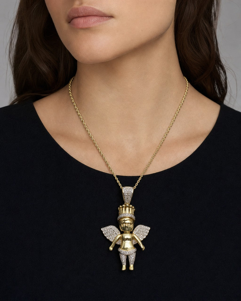 Female model wearing 10K Baby Angel With Crown Diamond Pendant