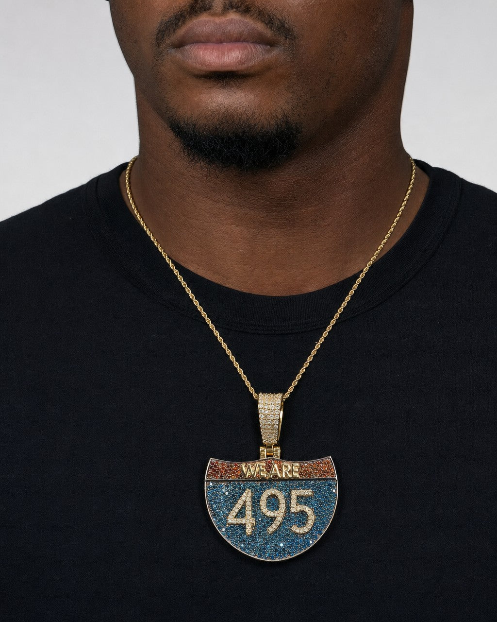 Male model wearing 14K Interstate 495 Diamond Pendant FREE Chain Included