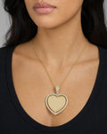 Female model wearing 14K Spinning Heart Picture Photo Pendant