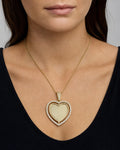 Female model wearing 14K Spinning Heart Picture Photo Pendant