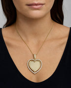 Female model wearing 14K Spinning Heart Picture Photo Pendant