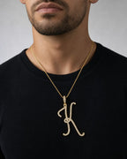 Male model wearing 14K Initial K Large Script Pendant