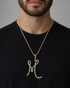 Male model wearing 14k Initial M Large Script Pendant