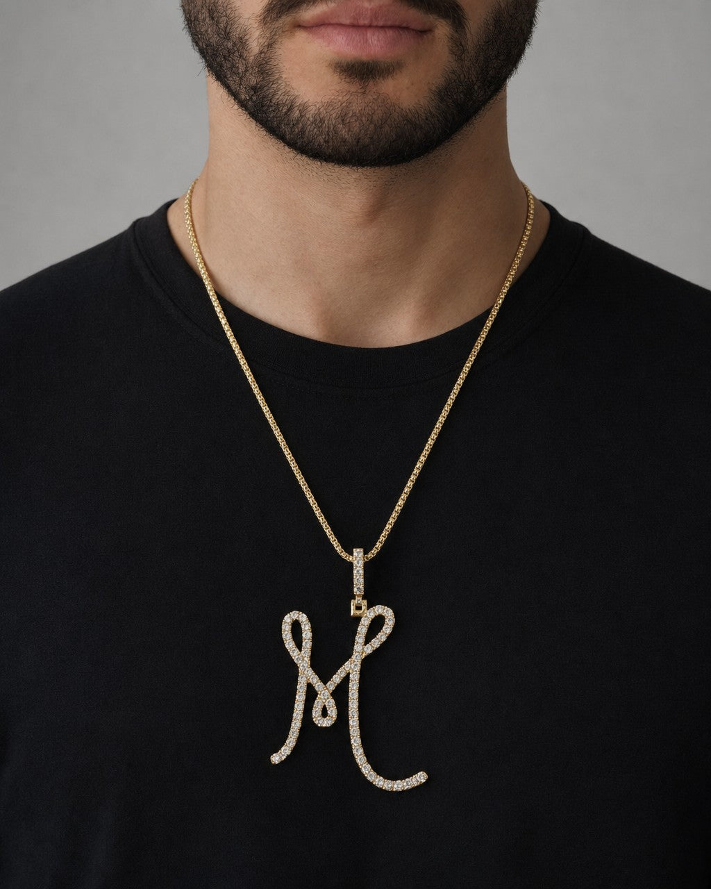 Male model wearing 14k Initial M Large Script Pendant