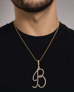 Male model wearing 14k Initial B Large Script Pendant