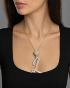 Female model wearing 14k Initial L Script Heart Diamond Pendant