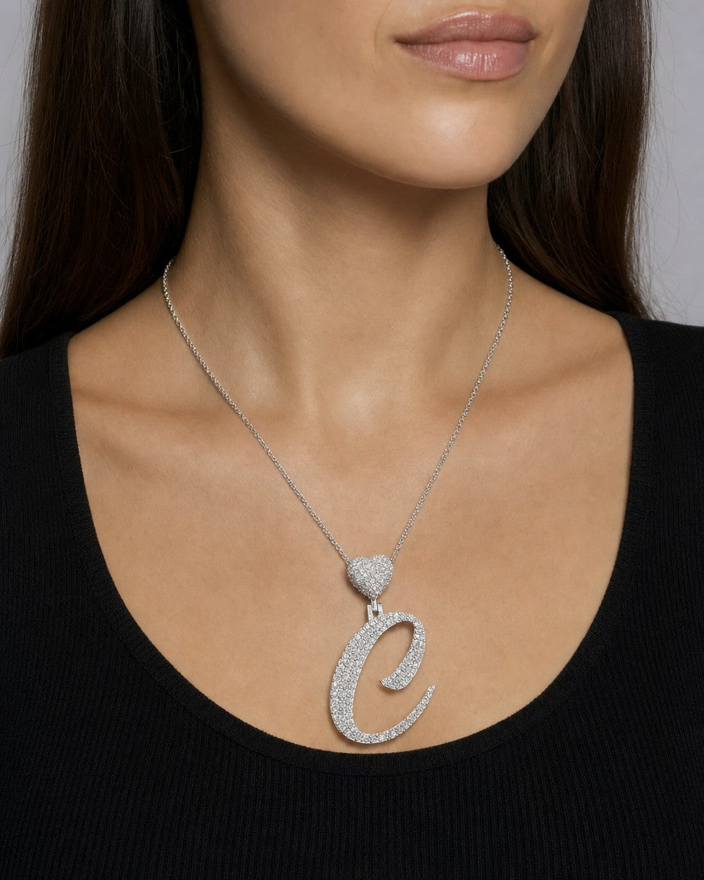 Female model wearing 14k Initial C Script Heart Diamond Pendant