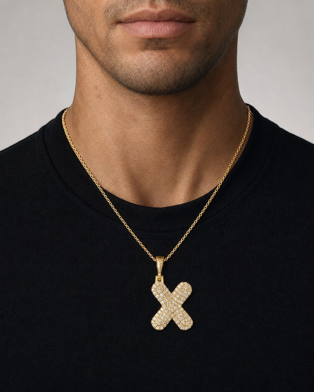 Male model wearing 14k Initial X Bubble Pendant