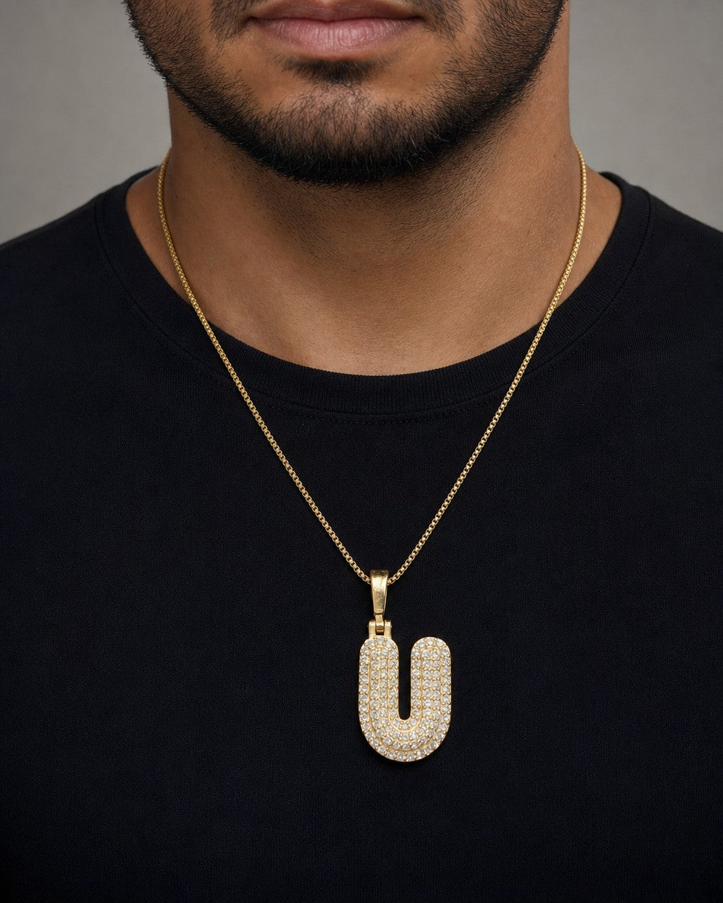 Male model wearing 14k Initial U Bubble Pendant