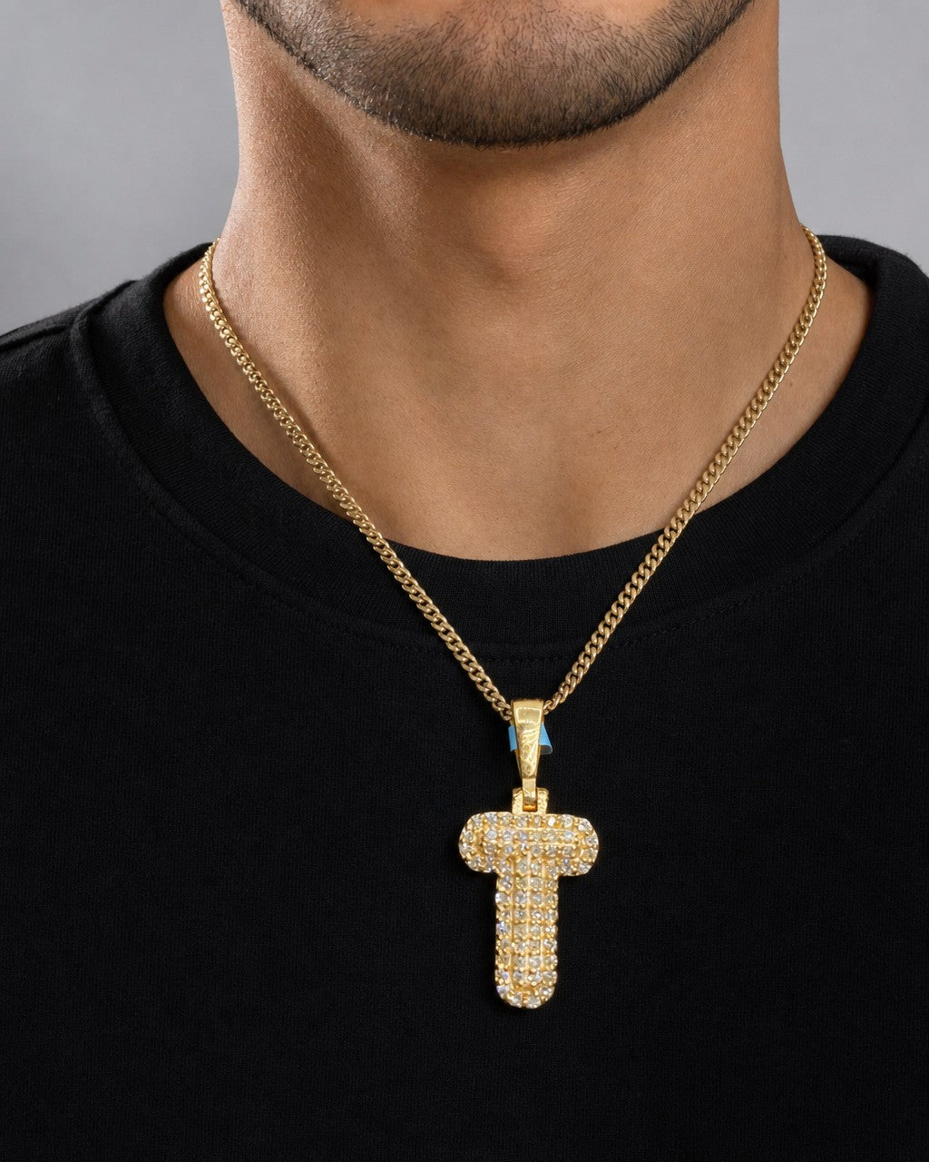 Male model wearing 14k Initial T Bubble Pendant