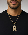 Male model wearing 14k Initial R Bubble Pendant