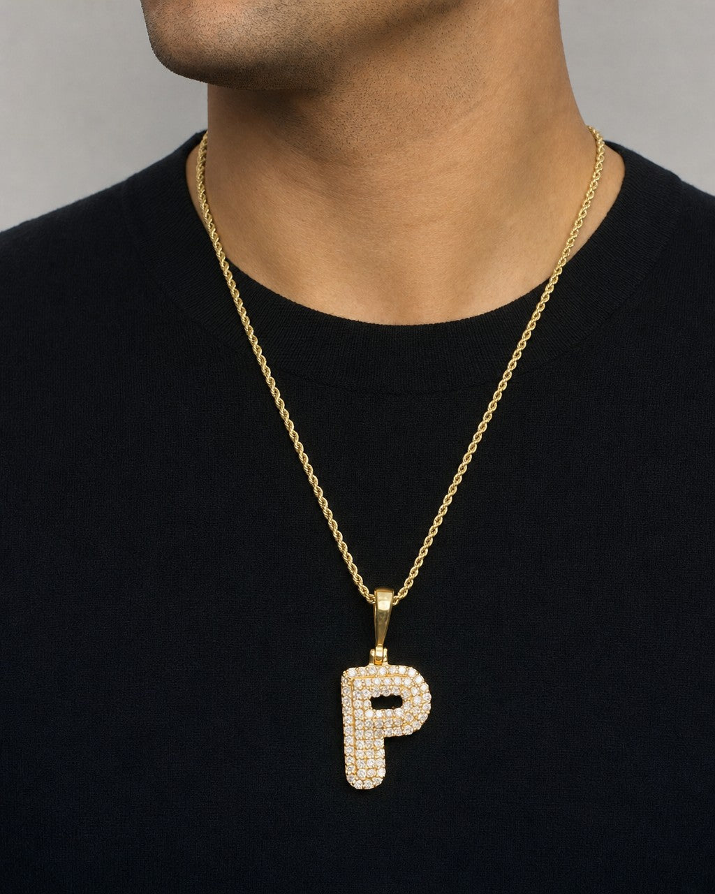 Male model wearing 14k Initial P Bubble Pendant