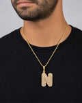 Male model wearing 14k Initial N Bubble Pendant