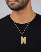 Male model wearing 14k Initial N Bubble Pendant