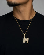 Male model wearing 14k Initial M Bubble Pendant