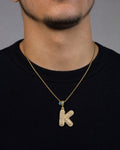 Male model wearing 14k Initial K Bubble Pendant