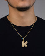 Male model wearing 14k Initial K Bubble Pendant