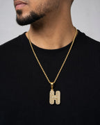 Male model wearing 14k Initial H Bubble Pendant
