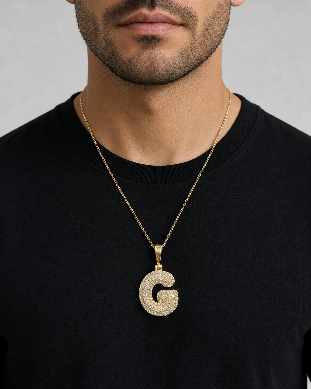 Male model wearing 14k Initial G Bubble Pendant