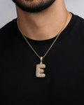 Male model wearing 14k Initial E Bubble Pendant
