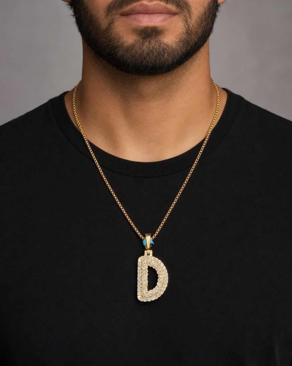 Male model wearing 14K Initial D Bubble Pendant