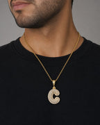 Male model wearing 14k Initial C Bubble Pendant