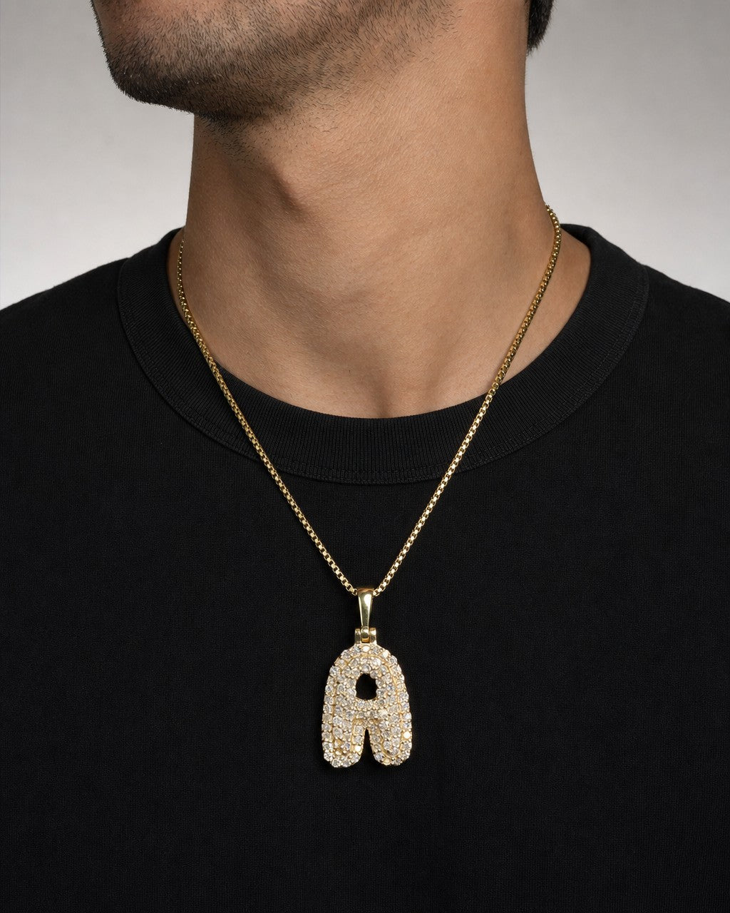 Male model wearing 14k Initial A Bubble Pendant